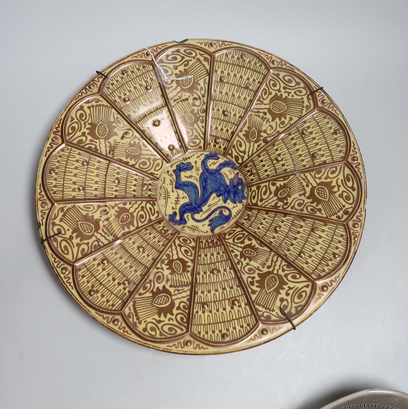 A Spanish Hispano-Moresque lustre charger, a Clarice Cliff Bizarre plate and a German bowl, largest 35cm
